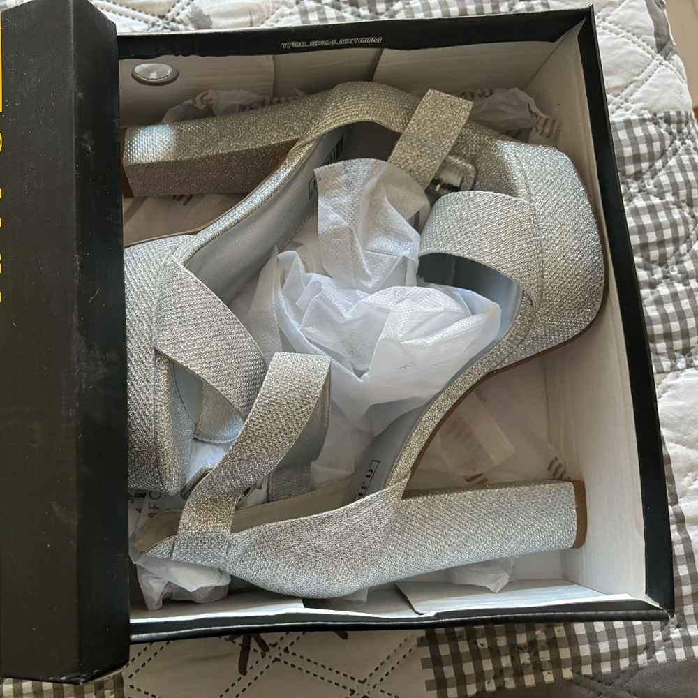 One 5” High Heeled Shoes. One use only